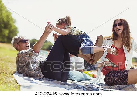 Playful grandmother and granddaughter on blanket in sunny field View Large Photo Image Stock Photography - Playful grandmother and granddaughter on blanket in sunny field. Fotosearch