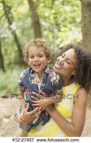 Portrait enthusiastic mother and son in woods View Large Photo Image Stock Photo - Portrait enthusiastic mother and son in woods. Fotosearch