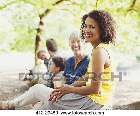 Portrait laughing multi-generation family in woods View Large Photo Image Stock Photo - Portrait laughing multi-generation family in woods. Fotosearch