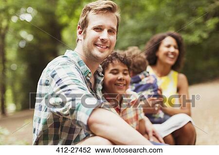 Stock Image - Portrait smiling father with son. Fotosearch