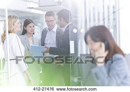 Business people talking in conference room View Large Photo Image Stock Photograph - Business people talking in conference room. Fotosearch