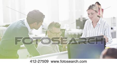Business people working at computer in office View Large Photo Image Stock Photo - Business people working at computer in office. Fotosearch