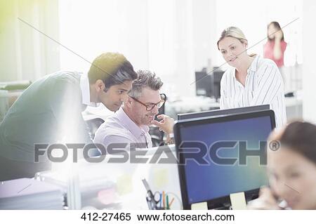 Business people working at computer in office View Large Photo Image Stock Photography - Business people working at computer in office. Fotosearch