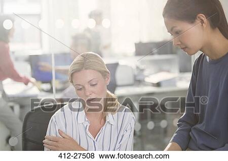 Businesswomen working in office View Large Photo Image Stock Photo - Businesswomen working in office. Fotosearch