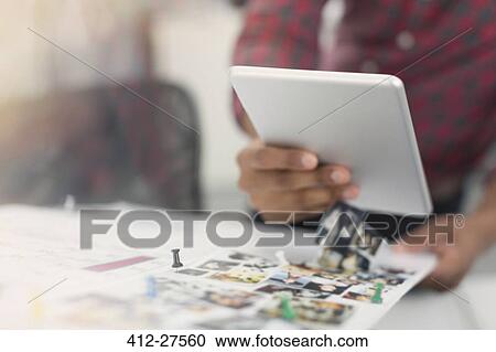 Close up fashion designer with digital tablet and photograph proofs View Large Photo Image Stock Image - Close up fashion designer with digital tablet and photograph proofs. Fotosearch