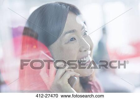 Close up smiling businesswoman talking on cell phone View Large Photo Image Stock Image - Close up smiling businesswoman talking on cell phone. Fotosearch