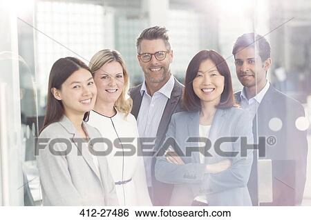 Portrait confident business people in office View Large Photo Image Stock Photograph - Portrait confident business people in office. Fotosearch