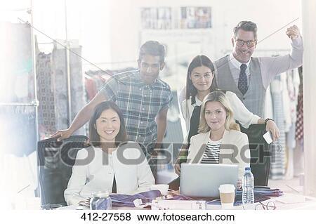 Stock Photo - Portrait confident fashion designers meeting in office. Fotosearch