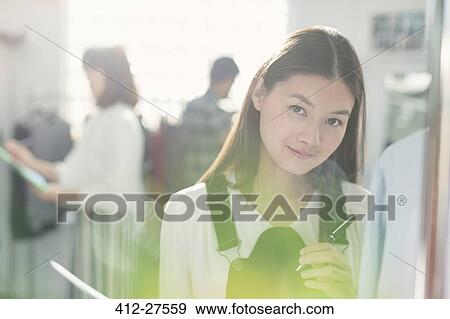 Portrait smiling fashion designer in office View Large Photo Image Stock Photo - Portrait smiling fashion designer in office. Fotosearch
