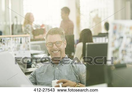 Portrait smiling fashion designer drinking coffee in office View Large Photo Image Stock Image - Portrait smiling fashion designer drinking coffee in office. Fotosearch