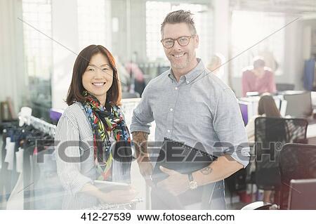 Portrait smiling fashion designers in office View Large Photo Image Stock Photo - Portrait smiling fashion designers in office. Fotosearch