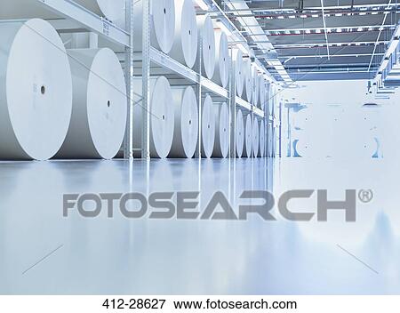 Stock Photo - Large spools of paper in printing plant. Fotosearch