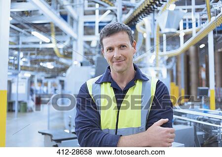 Stock Photo - Portrait confident worker in factor. Fotosearch