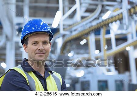 Stock Photography - Portrait confident worker in hard-hat. Fotosearch