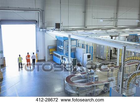 Workers at loading dock doorway in factory View Large Photo Image Stock Image - Workers at loading dock doorway in factory. Fotosearch