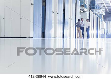 Workers talking in factory View Large Photo Image Picture - Workers talking in factory. Fotosearch