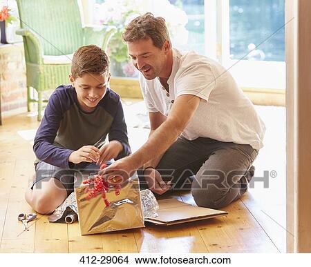 Father and son making robot costume View Large Photo Image Picture - Father and son making robot costume. Fotosearch