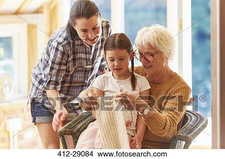 Grandmother teaching granddaughter knitting View Large Photo Image Picture - Grandmother teaching granddaughter knitting. Fotosearch