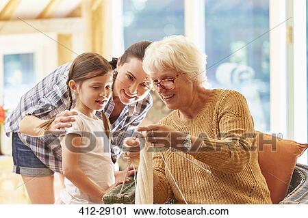 Grandmother teaching granddaughter knitting View Large Photo Image Stock Image - Grandmother teaching granddaughter knitting. Fotosearch