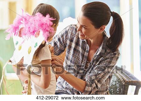 Mother fitting wings on daughter View Large Photo Image Stock Image - Mother fitting wings on daughter. Fotosearch