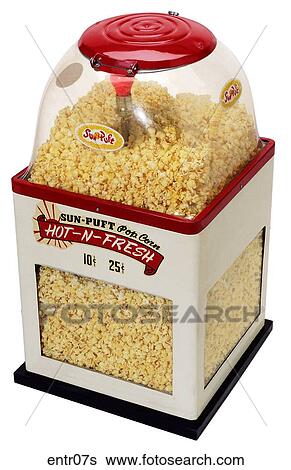 Stock Photograph - Maker: International Vending Machine Corporation Model: Sun Puff Year: 1952 3/4 View Popcorn Machine, red & white, clear glass bubble top, full of popcorn Entertainment . Fotosearch