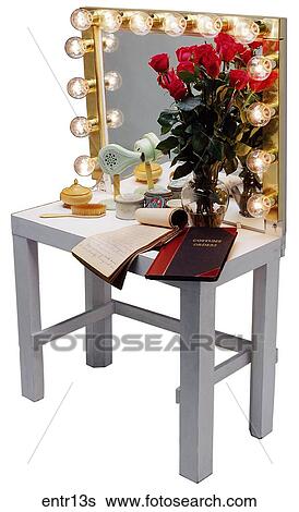 Stock Photograph - Maker: Unknown Model: 14 lights Year: 1950 3/4 View Make-up table with mirror and lights, red roses and various accessories are on table Entertainment . Fotosearch