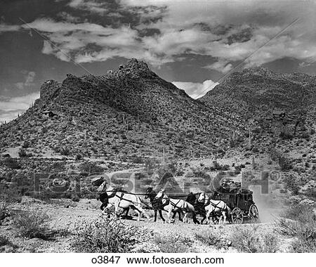 1800S Turn Of The Century Pair Of Men Driving Wagon Drawn By Team Of Six Horses Through Western Landscape View Large Photo Image Stock Photo - 1800S Turn Of The Century Pair Of Men Driving Wagon Drawn By Team Of Six Horses Through Western Landscape. Fotosearch