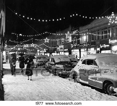 1940S 1950S Winter City Street Scene With Pedestrians In Snow Christmas Lights View Large Photo Image Stock Photo - 1940S 1950S Winter City Street Scene With Pedestrians In Snow Christmas Lights . Fotosearch