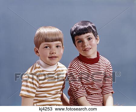 Stock Image - 1960 1960S Boy Girl Portrait Smiling Children Kids Wearing Red White Striped Tee Shirts Retro . Fotosearch