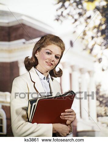 1960 1960S Coed Portrait Carrying Books Wearing White Blazer Student Teen Columns & Campus In Background Retro View Large Photo Image Stock Image - 1960 1960S Coed Portrait Carrying Books Wearing White Blazer Student Teen Columns & Campus In Background Retro . Fotosearch
