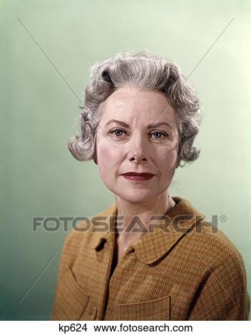 Picture - 1960 1960S Elderly Mature Senior Woman Portrait Unsmiling Serious Expression Orange Tweed Jacket Retro Women . Fotosearch