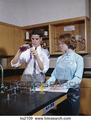 1960 1960S Two Teens Boy Girl Chemistry Class Experiment High School Teen Lab Laboratory Retro View Large Photo Image Stock Photo - 1960 1960S Two Teens Boy Girl Chemistry Class Experiment High School Teen Lab Laboratory Retro . Fotosearch