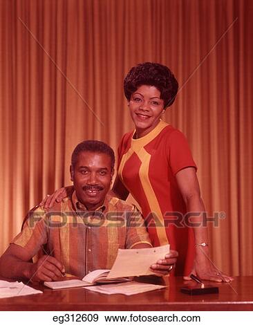 1960S African-American Couple Looking At Papers View Large Photo Image Stock Photo - 1960S African-American Couple Looking At Papers. Fotosearch