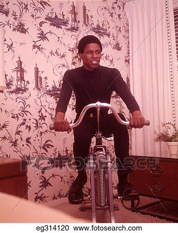 1960S African-American Man On Exercise Cycle View Large Photo Image Stock Image - 1960S African-American Man On Exercise Cycle. Fotosearch