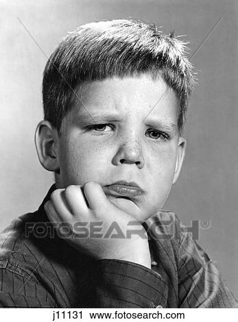 1960S Portrait Pouting Boy Hand To Chin Angry Sad Serious Facial Expression View Large Photo Image Stock Image - 1960S Portrait Pouting Boy Hand To Chin Angry Sad Serious Facial Expression . Fotosearch
