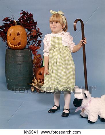 1970 1970S Blonde Blond Girl Costume Mary Little Lamb Green Gingham Dress Halloween Pumpkin View Large Photo Image Stock Image - 1970 1970S Blonde Blond Girl Costume Mary Little Lamb Green Gingham Dress Halloween Pumpkin . Fotosearch