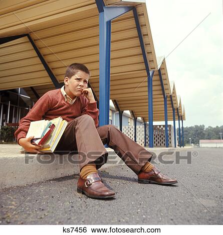1970 1970S Child Boy Schoolboy Kid Books Sitting Sidewalk Loafers School Roof Retro View Large Photo Image Stock Photograph - 1970 1970S Child Boy Schoolboy Kid Books Sitting Sidewalk Loafers School Roof Retro . Fotosearch