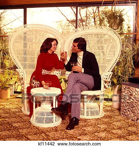 1970 1970s Man Woman Drinking Wine Patio Sitting White Wicker