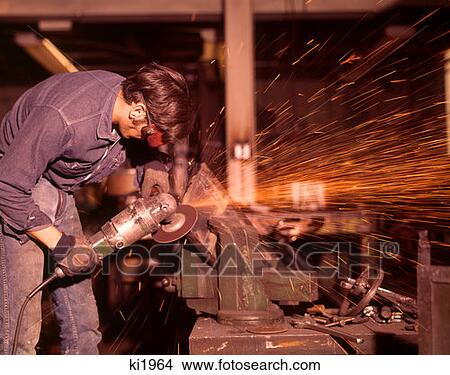 1970 1970S Man Working Metal Shop Sparks Welding Sanding Industry Worker Workers Men View Large Photo Image Picture - 1970 1970S Man Working Metal Shop Sparks Welding Sanding Industry Worker Workers Men . Fotosearch
