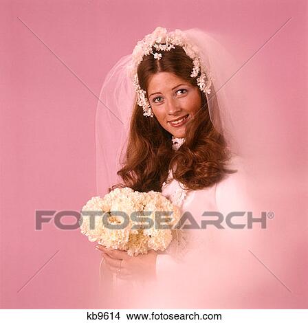 Picture - 1970 1970S Portrait Smiling Happy Bride White Bouquet Veil Marriage Marry Wed Wedding Brides Weddings Married Retro . Fotosearch