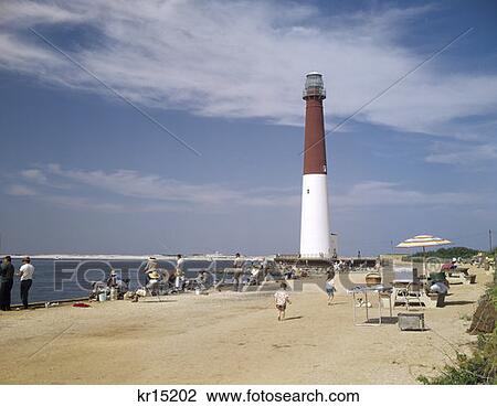 Stock Image - 1970 1970S Retro Barnegat Lighthouse Long Beach Island New Jersey Beach Shore. Fotosearch