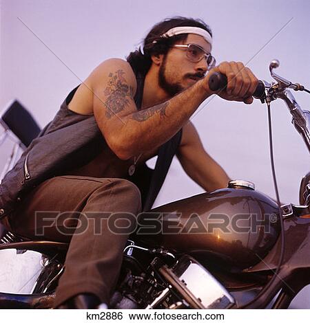 1970 1970S Retro Man Motorcycle Easy Rider With Headband Tattoos Mustache Beard Wire Frame Glasses View Large Photo Image Stock Photograph - 1970 1970S Retro Man Motorcycle Easy Rider With Headband Tattoos Mustache Beard Wire Frame Glasses . Fotosearch