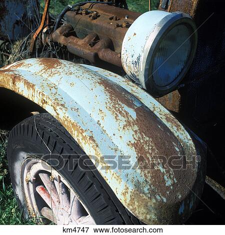 1970 1970S Rusty Antique Automobile Fender Wood Wheel Tire Engine Block And Headlight View Large Photo Image Stock Photo - 1970 1970S Rusty Antique Automobile Fender Wood Wheel Tire Engine Block And Headlight . Fotosearch