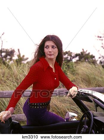 1970 1970S Sexy Brunette Woman Red Shirt Leaning On 