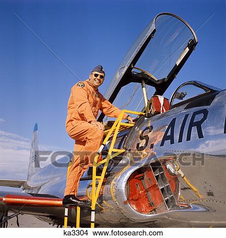 Picture - 1970 1970S Smiling Military Pilot Ladder Climbing Enter Cockpit Jet Wearing Orange Flight Jump Suit Pilots Men Retro . Fotosearch