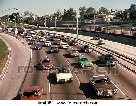 1970 1970S Traffic Kennedy Expressway Chicago Il Express Lane Parallel Commuter Train Tracks Commuters View Large Photo Image Stock Image - 1970 1970S Traffic Kennedy Expressway Chicago Il Express Lane Parallel Commuter Train Tracks Commuters . Fotosearch