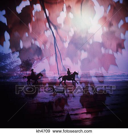 1970S 1980S Silhouette Of Two Figures Riding Horses On Beach With Autumn Leaves In Foreground And Purple Tints View Large Photo Image Stock Photo - 1970S 1980S Silhouette Of Two Figures Riding Horses On Beach With Autumn Leaves In Foreground And Purple Tints. Fotosearch
