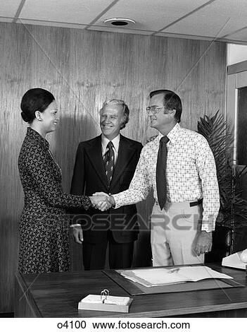 1970S 2 Men One African-American Woman Shaking Hands Agreement At Business Meeting View Large Photo Image Stock Image - 1970S 2 Men One African-American Woman Shaking Hands Agreement At Business Meeting. Fotosearch