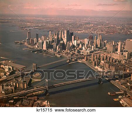 1970S Aerial Downtown Manhattan Looking South Brooklyn & Mahattan Bridge World Trade Center Under Construction Retro View Large Photo Image Stock Photography - 1970S Aerial Downtown Manhattan Looking South Brooklyn & Mahattan Bridge World Trade Center Under Construction Retro . Fotosearch
