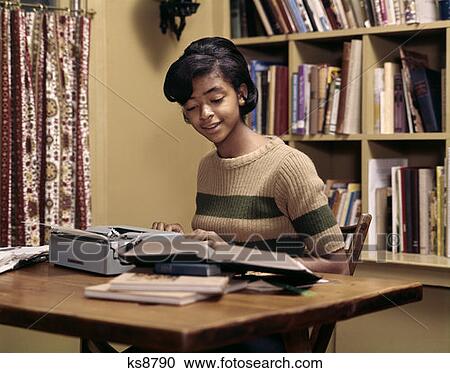 1970S African-American Teen Girl Book Using Portable Typewriter View Large Photo Image Stock Image - 1970S African-American Teen Girl Book Using Portable Typewriter . Fotosearch